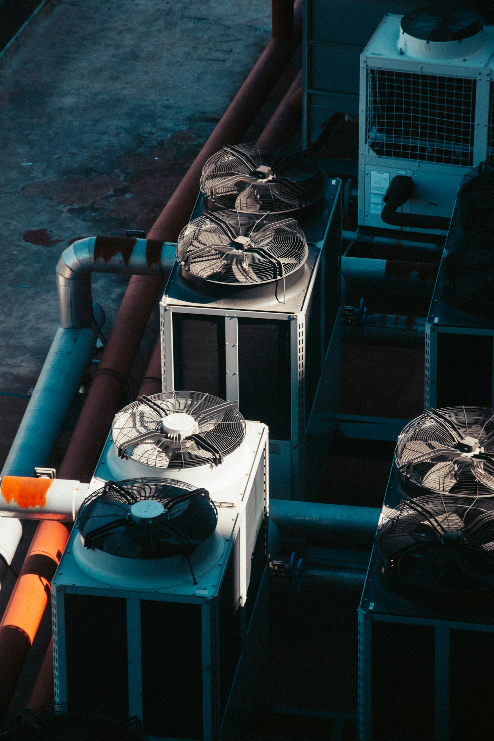 Rooftop air-conditioning units lined up on a building