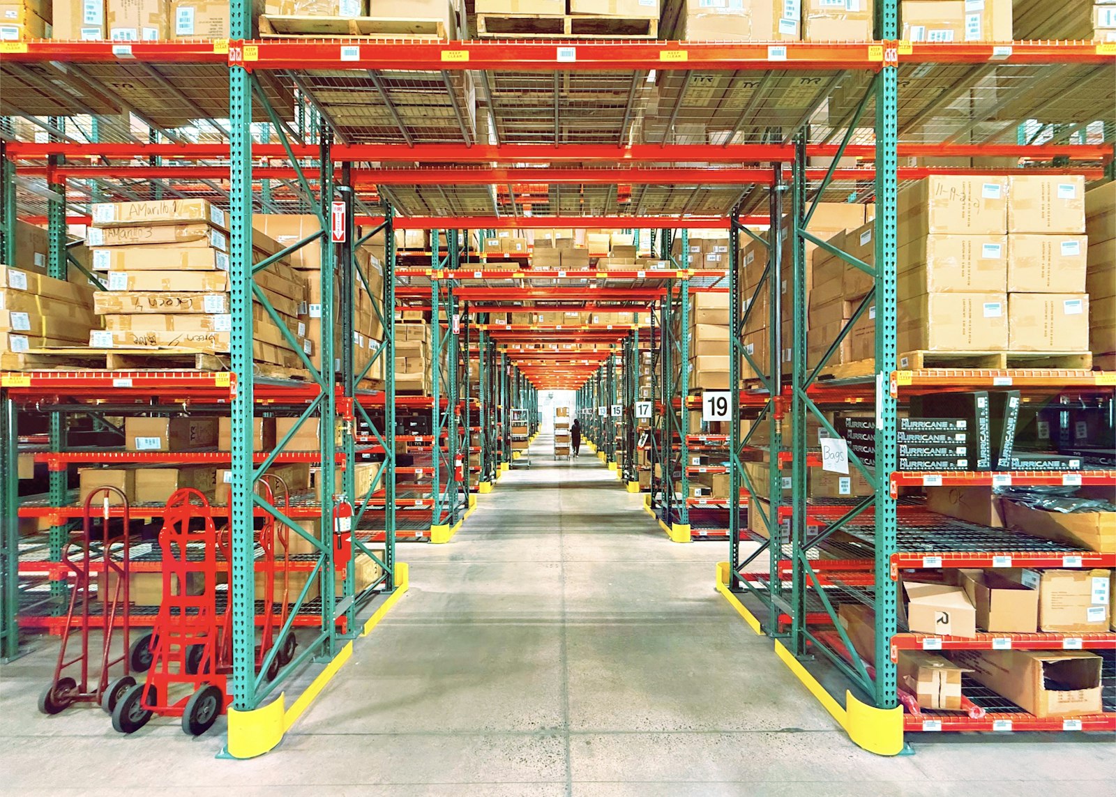 Warehouse interior A warehouse filled with racking and stacked boxes